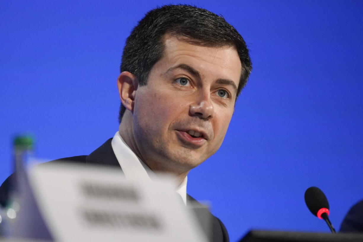 FILE - Secretary of Transportation Pete Buttigieg speaks at the COP26 U.N. Climate Summit, in Glasgow, Scotland, Nov. 10, 2021. Buttigieg has pledged to make racial equity a top priority. His department is reviewing civil rights and environmental justice concerns raised about a $9 billion highway widening project being proposed in the Houston area.