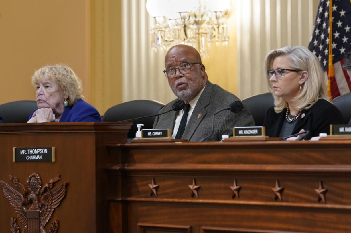 House Jan. 6 Select Committee Chairman Bennie Thompson, D-Miss., center, flanked by Rep. Zoe Lofgren, D-Calif., left, and Vice Chair Liz Cheney, R-Wyo., meet to vote on pursuing contempt charges against Jeffrey Clark, a former Justice Department lawyer who aligned with former President Donald Trump as Trump tried to overturn his election defeat, at the Capitol in Washington, Wednesday, Dec. 1, 2021. (AP Photo/J.