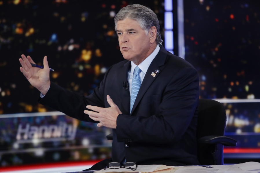 FILE - Fox News host Sean Hannity speaks during a taping of his show, "Hannity," on Aug. 7, 2019, in New York. The revelation that Fox News Channel personalities sent text messages to the White House during the Jan.