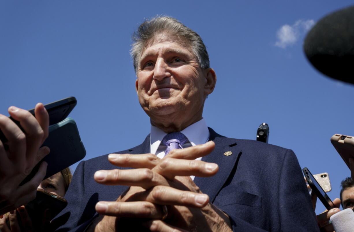 Sen. Joe Manchin, D-W.Va., a centrist Democrat vital to the fate of President Joe Biden's $3.5 government overhaul, updates reporters about his position on the bill, at the Capitol in Washington, Thursday, Sept. 30, 2021. Despite months of being courted and cajoled, Sen. Joe Manchin is still not a yes on President Joe Biden's big $2 trillion domestic package and has thrown Democrats into turmoil. (AP Photo/J.