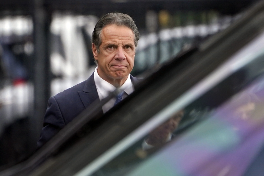 FILE - New York Gov. Andrew Cuomo prepares to board a helicopter after announcing his resignation, on Aug. 10, 2021, in New York. Cuomo won't face criminal charges after a female state trooper said she felt "completely violated" by his unwanted touching at an event at Belmont Park in September 2019, a Long Island prosecutor said Thursday, Dec. 23, 2021.