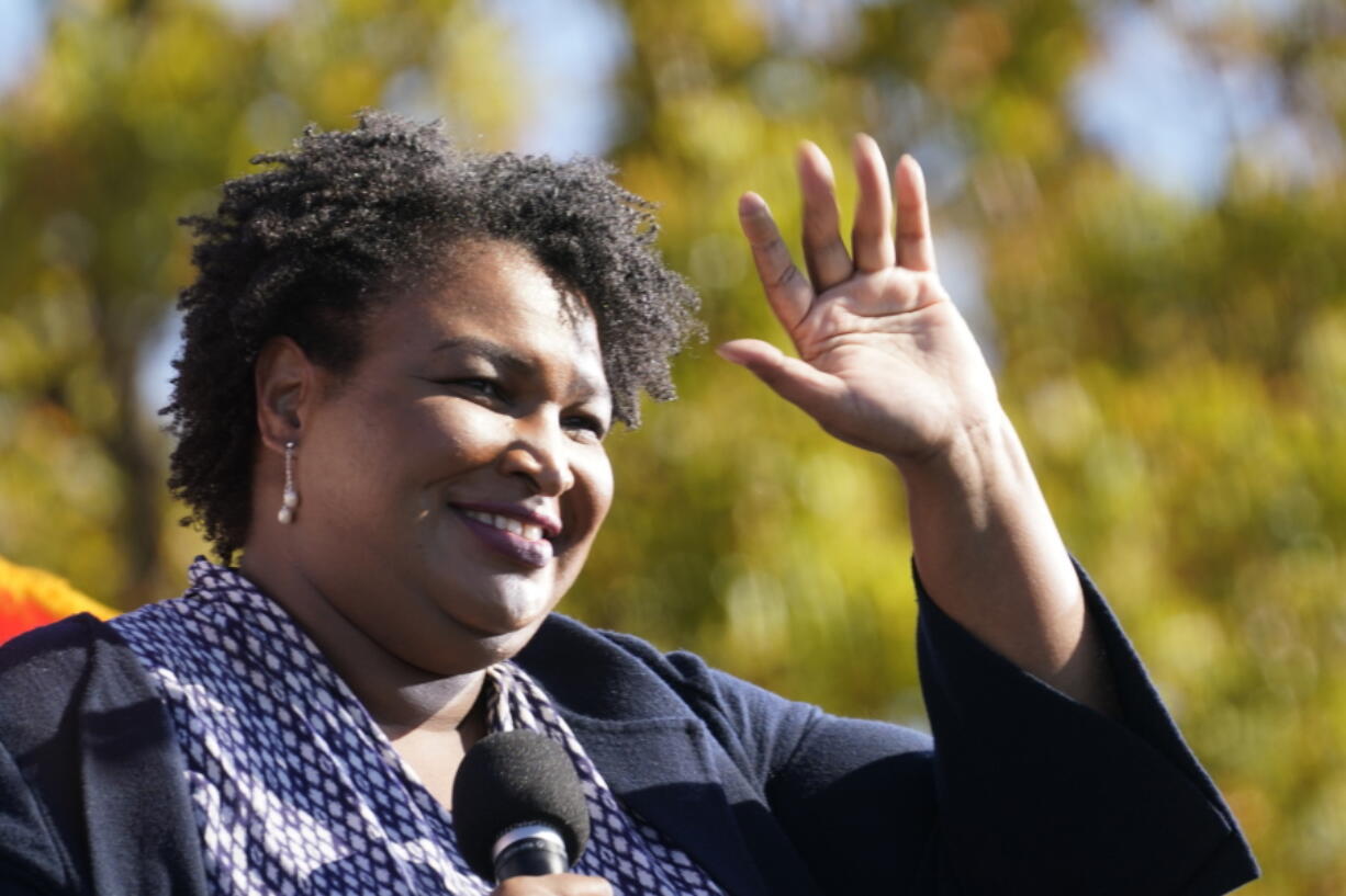 FILE - In this Monday, Nov. 2, 2020, file photo, Stacey Abrams speaks to Biden supporters as they wait for former President Barack Obama to arrive and speak at a campaign rally for Biden at Turner Field in Atlanta.