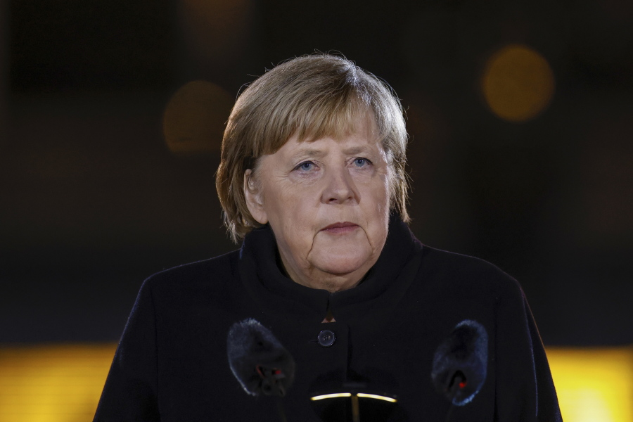 German Chancellor Angela Merkel makes a speech at the Defence Ministry during the Grand Tattoo (Grosser Zapfenstreich), a ceremonial send-off for her, in Berlin on Thursday, Dec. 2, 2021.