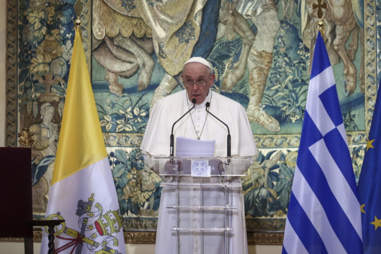 Pope Francis delivers his speech during a meeting with authorities, at the Presidential Palace, in Athens, Saturday, Dec. 4, 2021. Pope Francis arrived to Greece Saturday for the second leg of his trip to the region with meetings in Athens aimed at bolstering recently-mended ties between the Vatican and Orthodox churches.