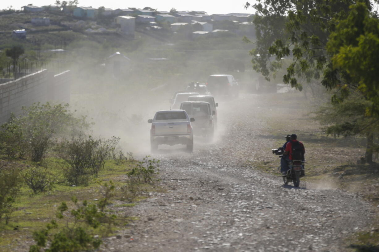 A caravan drives to the airport after departing from the Christian Aid Ministries headquarters at Titanyen, north of Port-au-Prince, Haiti, Dec. 16, 2021. Twelve remaining members of a U.S.-based missionary group who were kidnapped two months ago have been freed, according to the group and to Haitian police.