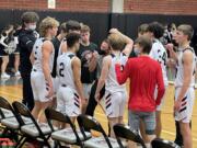 Union head coach Blake Conley, center, talks to his team during a timeout against Mount Si on Saturday at Union High School.