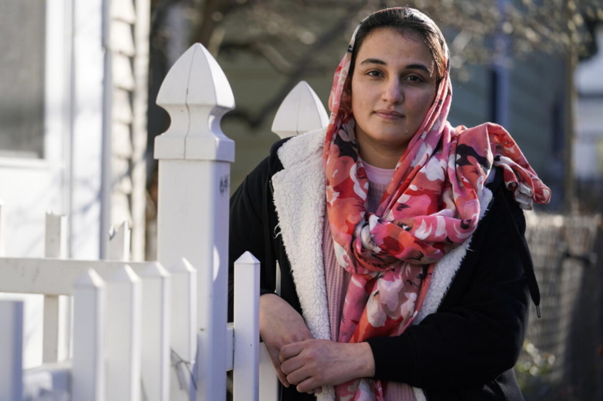 Haseena Niazi, a 24-year-old from Afghanistan, poses outside her home, Friday, Dec. 17, 2021, north of Boston. Niazi received a letter from the federal government denying her fianc?'s humanitarian parole application earlier in the month. Her fiance, who she asked not to be named over concerns about his safety, had received threats from Taliban members for working on women's health issues at a hospital north of Kabul.