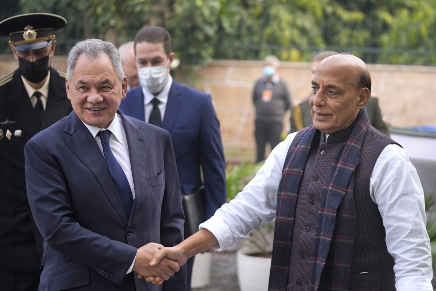 Indian Defence Minister Rajnath Singh, right, shakes hand with his Russian counterpart Sergey Shoygu in New Delhi, India, Monday, Dec. 6, 2021. Indian Prime Minister Narendra Modi meets with Russian President Vladimir Putin on Monday to discuss defense and trade relations as India attempts to balance its ties with the United States.
