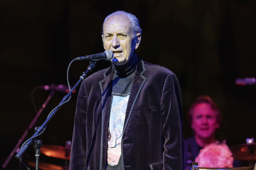 FILE - Mike Nesmith, of The Monkees, performs in Rosemont, Ill., on Nov. 5, 2021. Nesmith, the guitar-strumming member of the 1960s, made-for-television rock band The Monkees, died at home Friday of natural causes, his family said in a statement. He was 78.