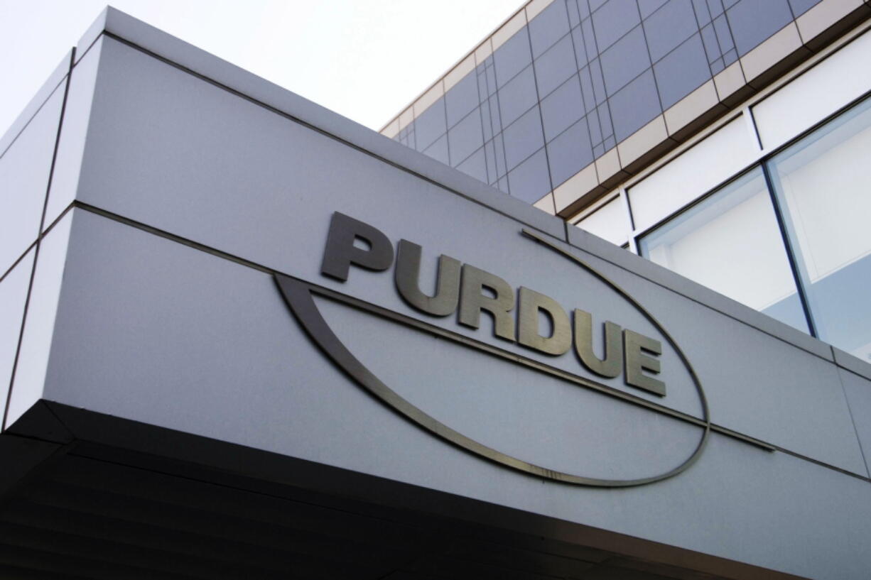FILE - This Tuesday, May 8, 2007, file photo shows the logo for pharmaceutical giant Purdue Pharma at its offices in Stamford, Conn. A federal judge on Thursday, Dec. 16, 2021, has rejected OxyContin maker Purdue Pharma's bankruptcy settlement of thousands of lawsuits over the opioid epidemic because of a provision that would protect members of the Sackler family from facing litigation of their own.