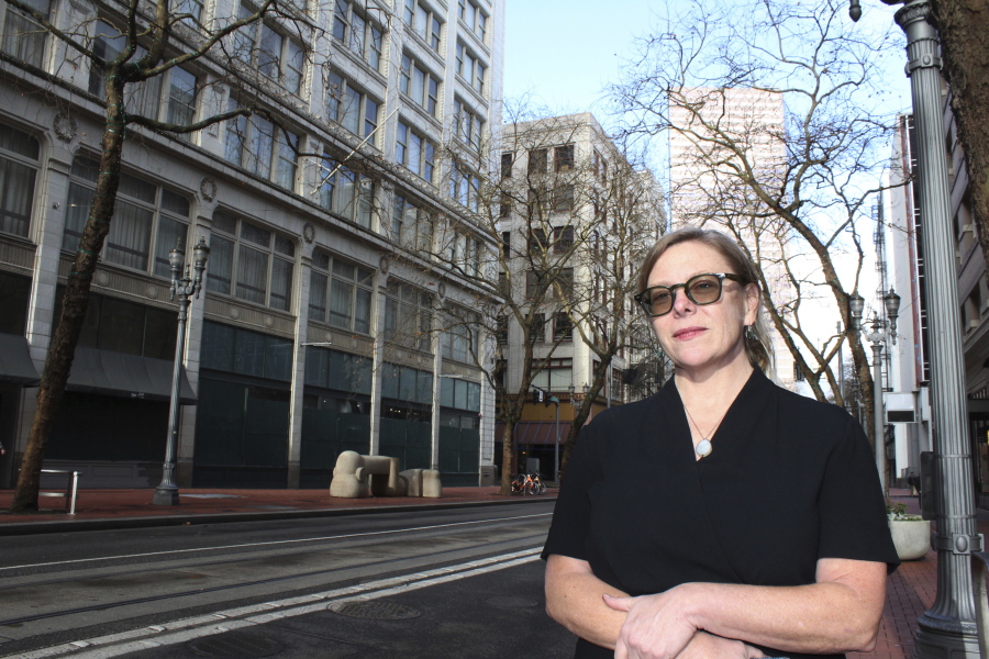 Sybil Hebb, the director of Legislative Advocacy for the Oregon Law Center, poses for a photo outside her office building in downtown Portland, Ore., on Wednesday, Dec. 8, 2021. Hebb works with tenants at risk of eviction. Since July, there have been more than 2,200 non-payment eviction proceedings filed in Oregon.