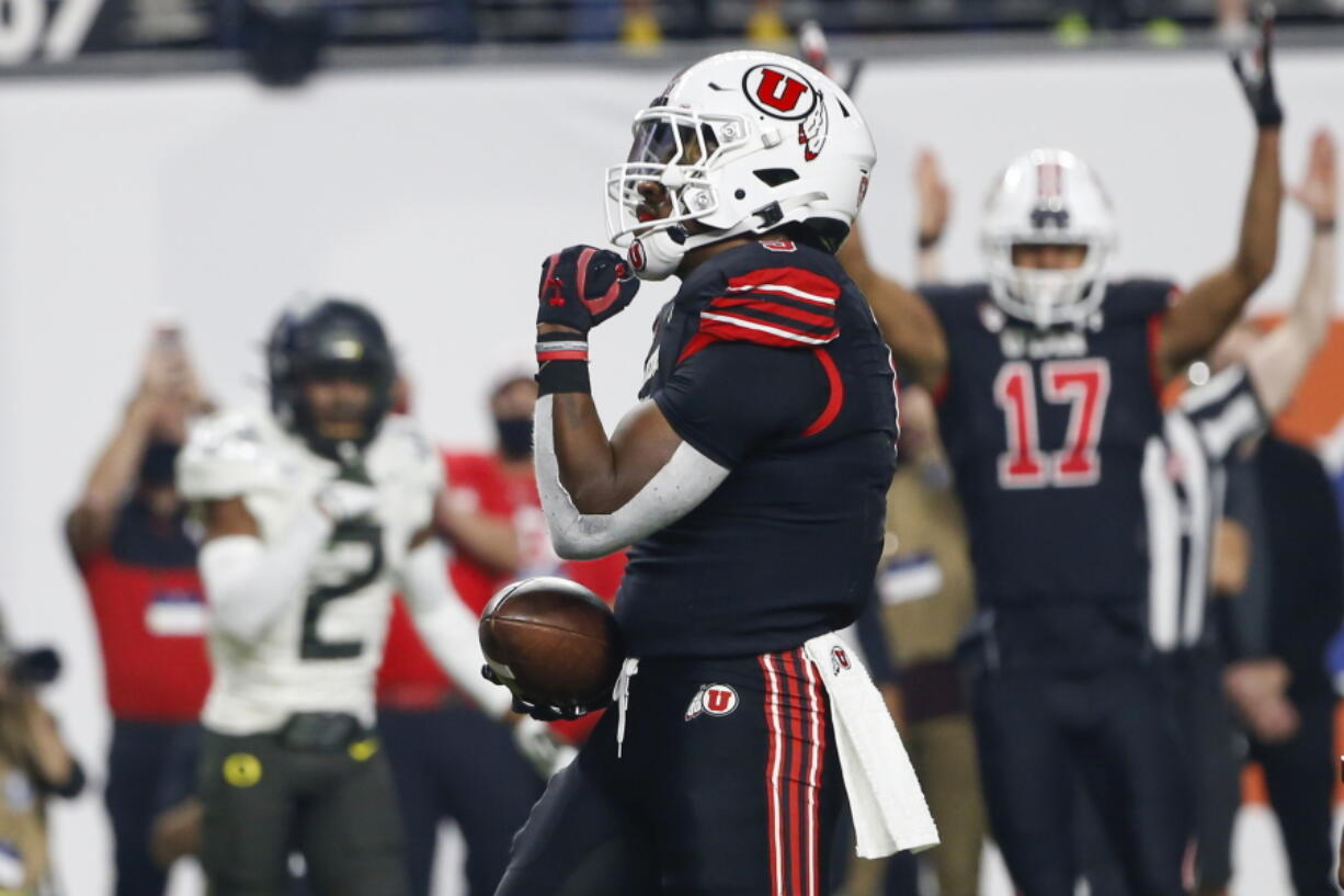 Utah running back Tavion Thomas (9) celebrates his touchdown against Oregon during the first half of the Pac-12 Conference championship NCAA college football game Friday, Dec. 3, 2021, in Las Vegas.