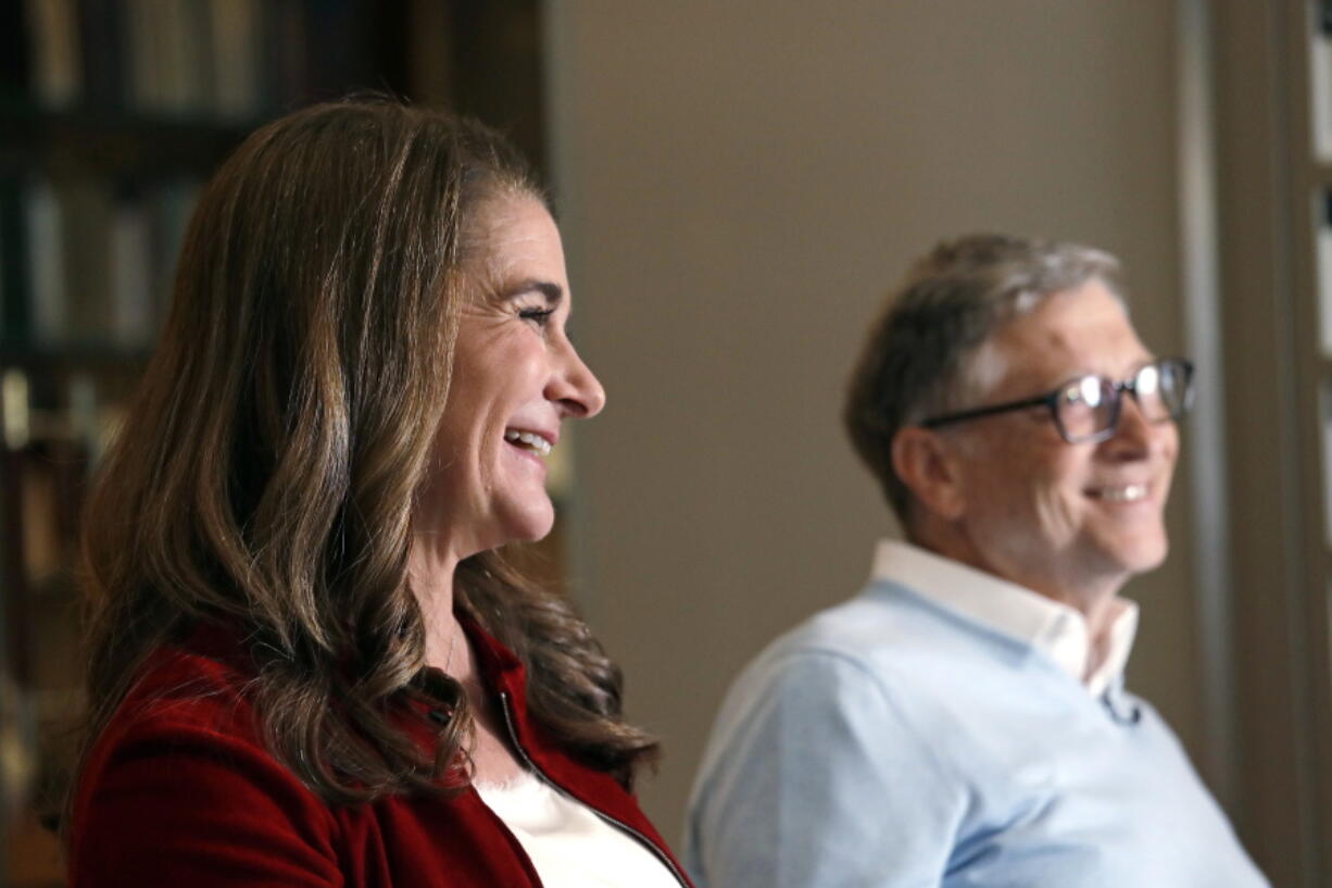 In this photo taken Feb. 1, 2019, Bill and Melinda Gates are interviewed in Kirkland, Wash. Bill Gates and Melinda French Gates will continue their work with the Giving Pledge, but, following their divorce earlier this year, they will do it separately and in their own ways. In individual letters posted Tuesday, Nov. 30, 2021 by Giving Pledge, the campaign they co-founded with Warren Buffett in 2010 to encourage billionaires to donate the majority of their wealth through philanthropy, Gates and French Gates outlined their differing philosophies to giving.