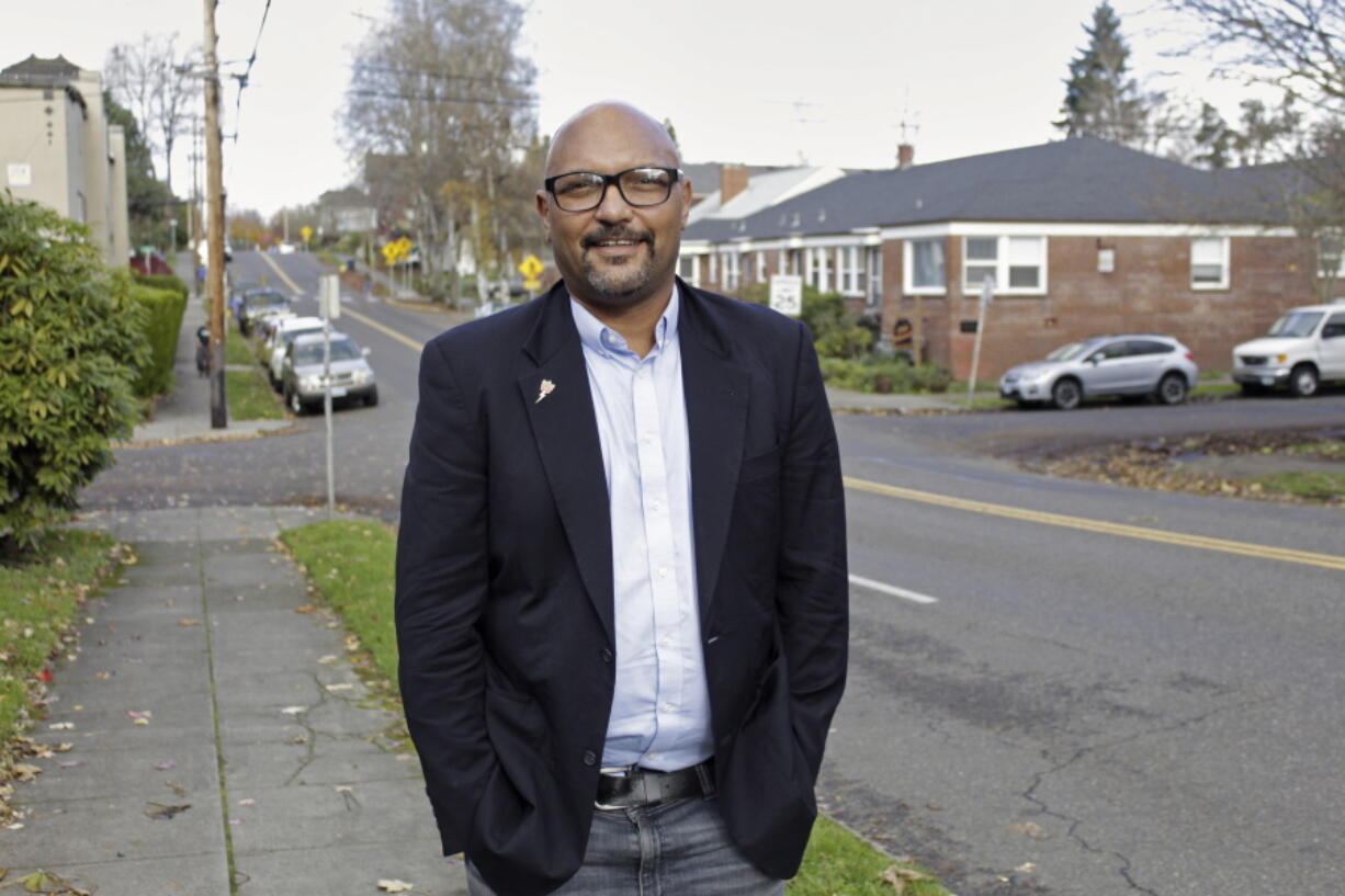 Portland City Councilman Mingus Mapps poses in front of his house in southwest Portland, Ore., on Nov. 16, 2021. Mapps, who took office in January, has become a key voice nudging Portland to a more centrist position on police funding as Portland grapples with its identity in the post-protest era.