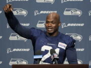 Adrian Peterson, who was signed to the Seattle Seahawks practice squad on Wednesday, talks to reporters Thursday, Dec. 2, 2021, before NFL football practice in Renton, Wash. (AP Photo/Ted S.