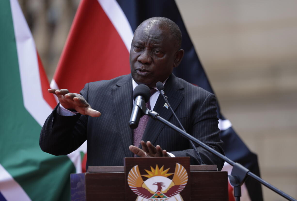 South African President Cyril Ramaphosa addresses the media after meeting with his Kenyan counterpart Uhuru Kenyatta in Pretoria, South Africa, Tuesday Nov. 23, 2021 . Kenyatta is in South Africa on a state visit to discuss political and economic issues.