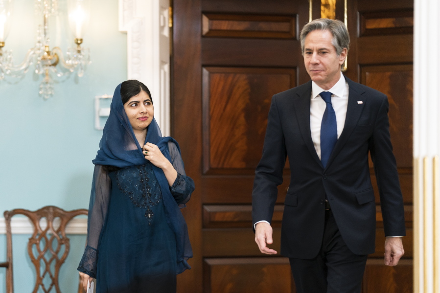 Secretary of State Antony Blinken and Pakistani activist for female education and a Nobel Peace Prize laureate Malala Yousafzai, walk to the Treaty Room at the State Department, Monday, Dec. 6, 2021, in Washington.