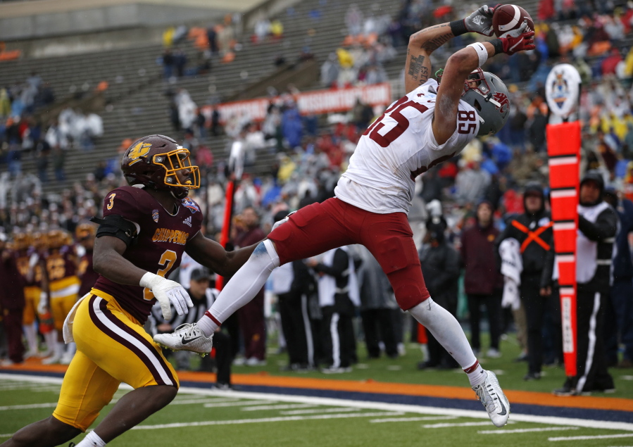 Washington State wide receiver Lincoln Victor (85) catches a pass in the end zone for a touchdown as Central Michigan defensive back Alonzo McCoy (3) defends  during the second half of the Sun Bowl NCAA college football game in El Paso, Texas, Friday, Dec. 31, 2021.