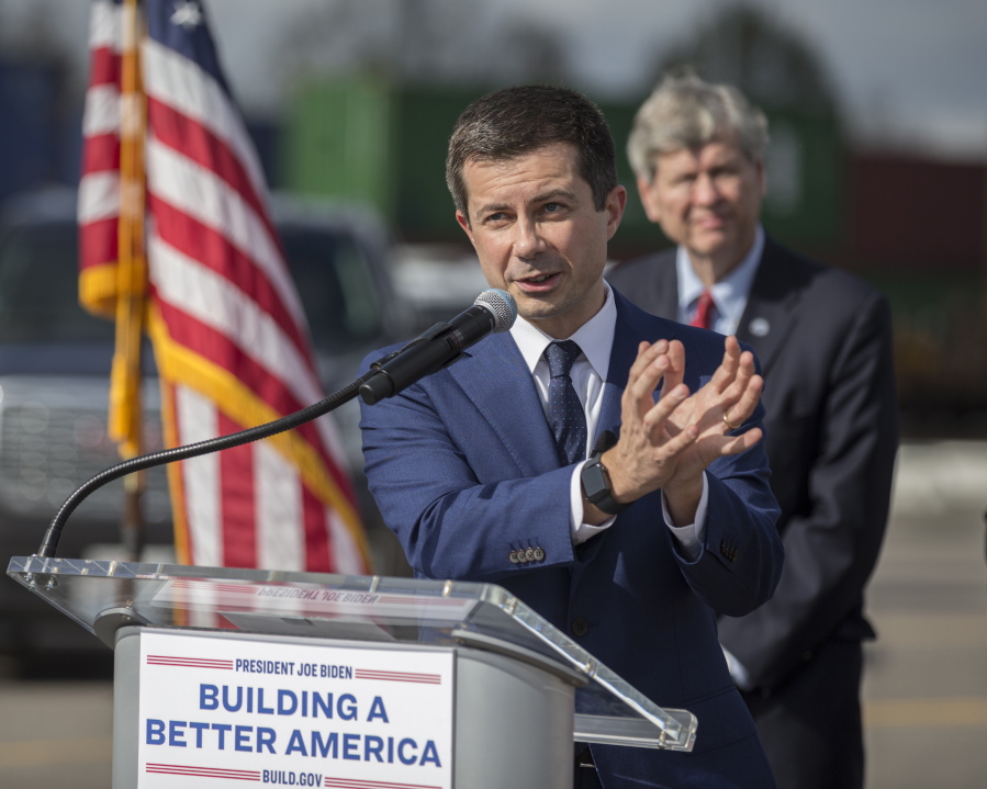 U.S. Transportation Secretary Pete Buttigieg speaks to the media during a visit to the Georgia Ports Authority's Megarail facility, Friday, Dec., 17, 2021 in Savannah, Ga.  Buttigieg used the visit to highlight the coordination with the his department and the Georgia Ports Authority to improve its cargo flow. (AP Photo/Stephen B.