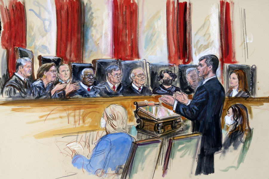 This artist sketch depicts Mississippi Solicitor General Scott Stewart, standing while speaking to the Supreme Court, Wednesday, Dec. 1, 2021, in Washington. Center for Reproductive Rights Litigation Director Julie Rikelman is seated right. Justices seated from left are Associate Justice Brett Kavanaugh, Associate Justice Elena Kagan, Associate Justice Samuel Alito, Associate Justice Clarence Thomas, Chief Justice John Roberts, Associate Justice Stephen Breyer, Associate Justice Sonia Sotomayor, Associate Justice Neil Gorsuch and Associate Justice Amy Coney Barrett.