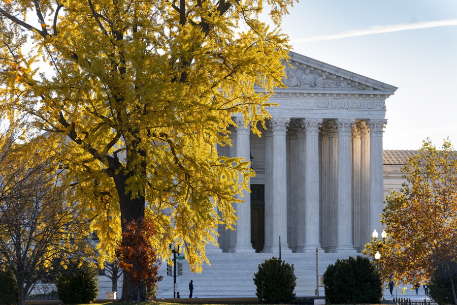 Light from the morning sun illuminates the Supreme Court in Washington, Friday, Dec. 3, 2021. The Supreme Court is hearing arguments in a challenge from parents in Maine who want to use a state tuition program to send their children to religious schools.  (AP Photo/J.