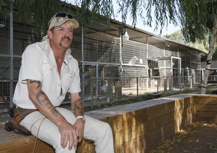 FILE - In this Aug. 28, 2013, file photo, Joseph Maldonado-Passage, also known as Joe Exotic, is seen at the zoo he used to run in Wynnewood, Okla. The former zookeeper has been transferred to a medical facility in North Carolina for federal inmates after a cancer diagnosis, according to his attorney.