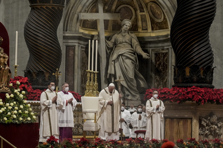 Pope Francis celebrates Christmas Eve Mass, at St. Peter's Basilica, at the Vatican, Friday Dec. 24, 2021. Pope Francis is celebrating Christmas Eve Mass before an estimated 1,500 people in St. Peter's Basilica. He's going ahead with the service despite the resurgence in COVID-19 cases that has prompted a new vaccine mandate for Vatican employees.
