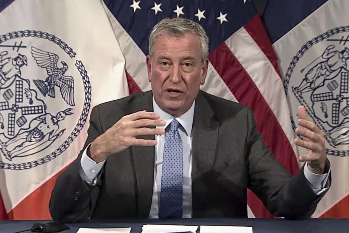 In this image taken from video, New York Mayor Bill de Blasio speaks during a virtual press conference, Thursday, Dec. 2, 2021, in New York. Multiple cases of the omicron coronavirus variant have been detected in New York, health officials said Thursday, including a man who attended an anime convention in Manhattan in late November and tested positive for the variant when he returned home to Minnesota.