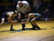 Wrestlers from Kelso and Evergreen compete at a 3A Greater St.