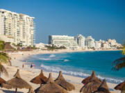 Resort hotels line the beach in Cancun, Mexico. Young tourists were picking Mexico and the Caribbean as their destinations of choice in 2022.