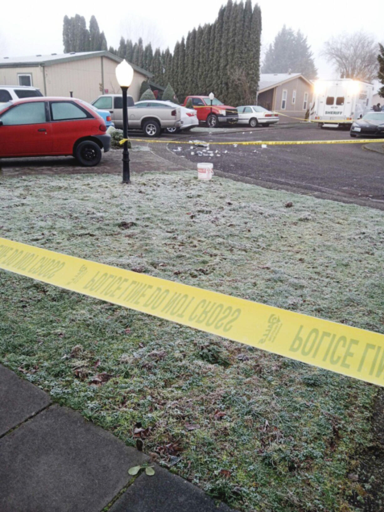 Police tape blocks off the area where Vancouver police officers fatally shot a man they say was armed with a knife Sunday morning. The shooting was at the Sky Ridge Estates mobile home park in Vancouver's North Image neighborhood.