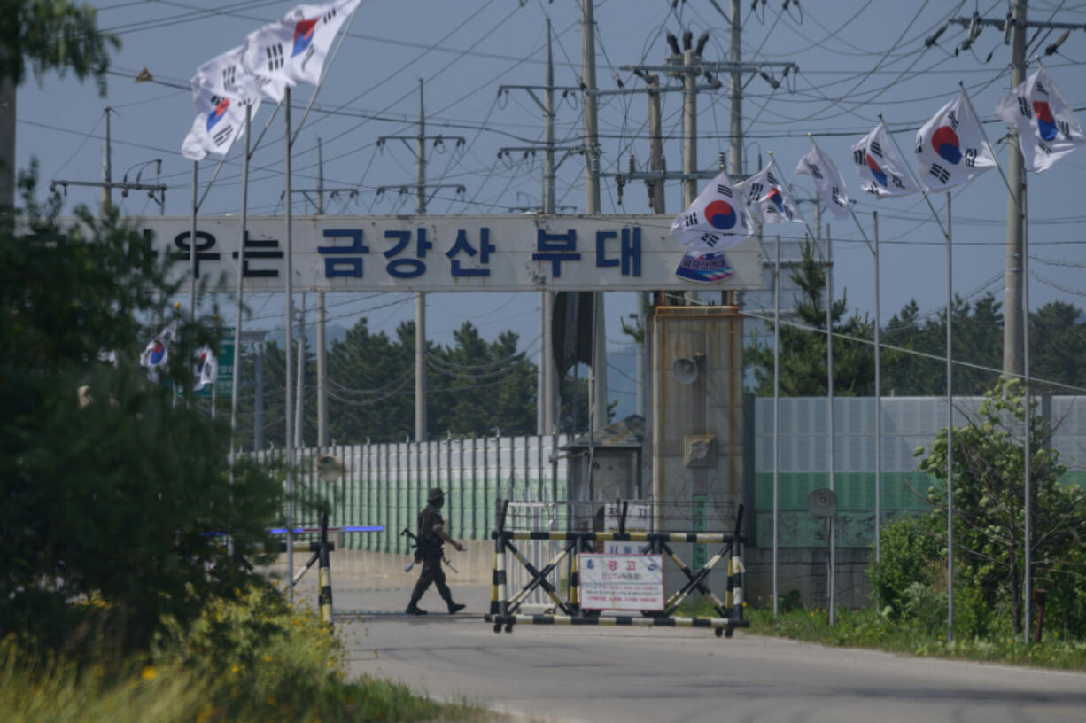 In this photo from June 17, 2020, a South Korean soldier guards the entrance to the camp Kumgang Mountain military base near the border area of Goseong on South Korea's northeast coast.