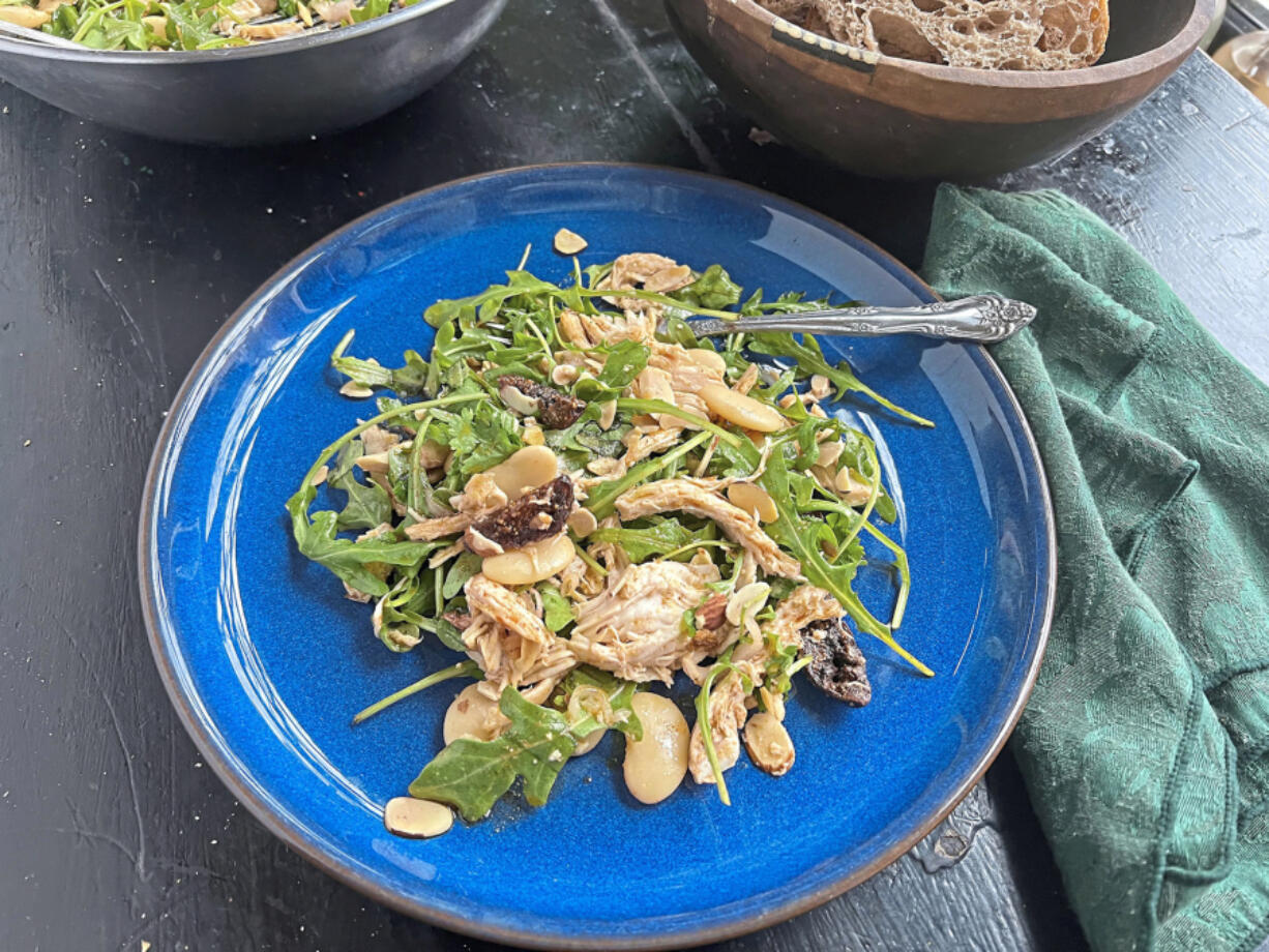 Rotisserie chicken is paired with butter beans, dried dates and arugula in this simple salad dressed in a smoky vinaigrette.