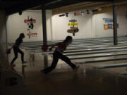 Bowlers compete at Triangle Bowl in the 2A district girls bowling tournament on Friday, Jan. 28, 2022.