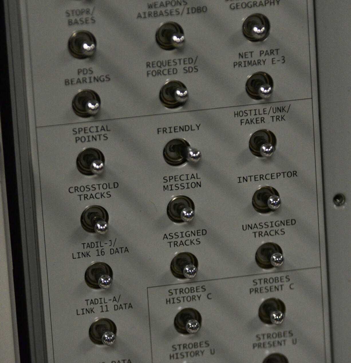 Switches sit on an Airborne Warning and Control System block at the PLEXSYS office in Camas. The business designs modeling and simulation software for air forces.