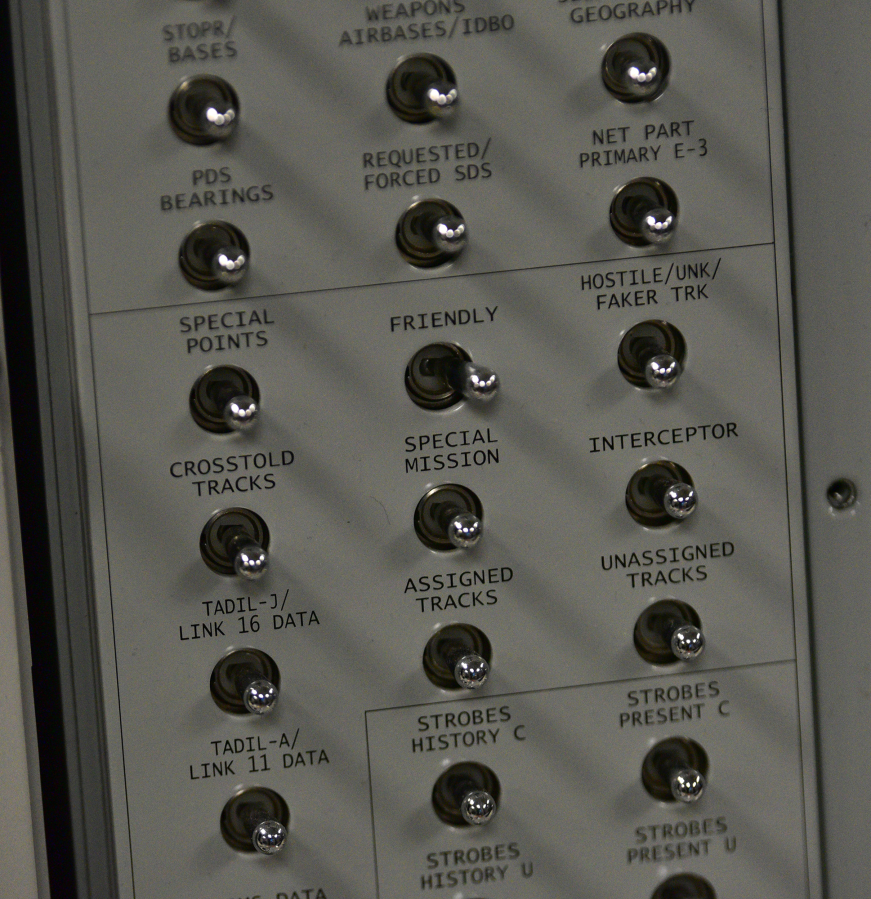 Switches sit on an Airborne Warning and Control System block at the PLEXSYS office in Camas. The business designs modeling and simulation software for air forces.