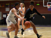 Skyview junior Jordan Labrador-Hallett, right, steals the ball from Heritage’s Sarah Bautista on Tuesday, Jan. 4, 2022, during the Storm’s 66-40 win against the Timberwolves at Heritage High School.
