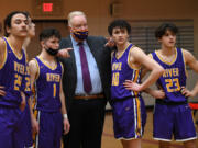 Columbia River High School boys basketball coach David Long, shown here with his starting lineup in a Jan. 19 victory over Fort Vancouver, is retiring after 32 seasons coaching basketball at the high school. Long leaves as Clark County's winningest boys basketball coach with 484 career victories, including 452 coaching the River boys.