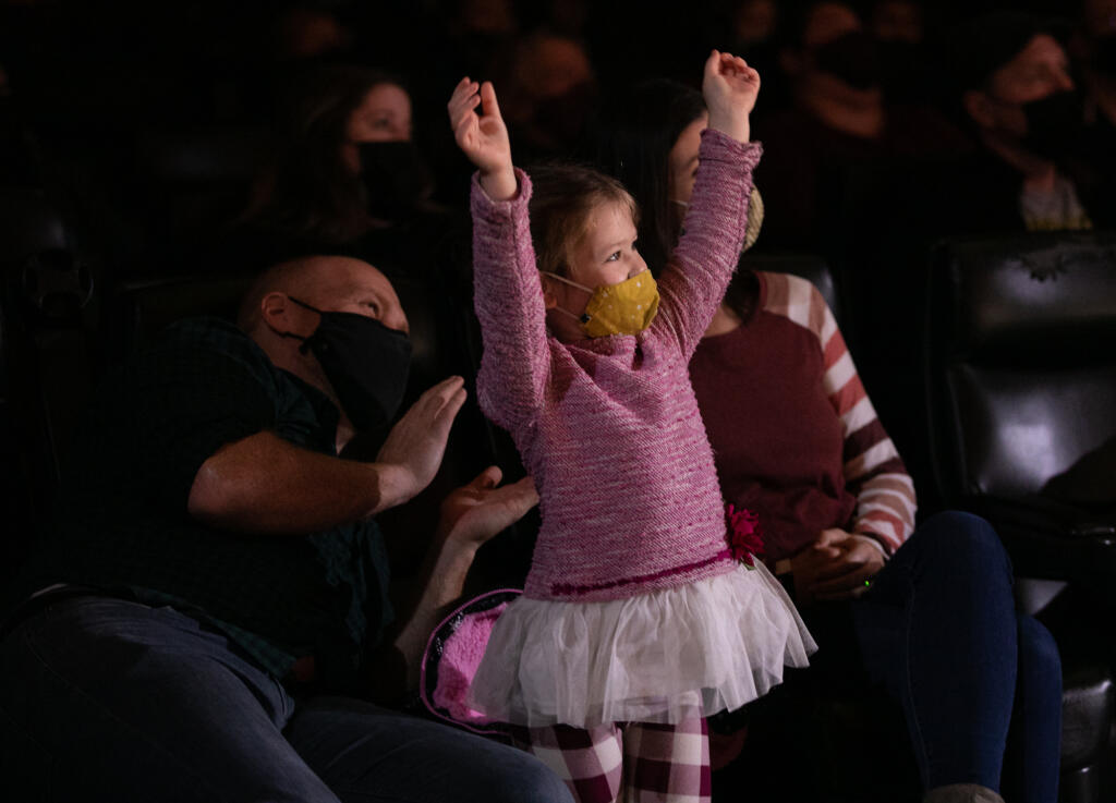 Adelyn Pfeiffer, 4, cheers as she watches a performance by The Amazing Bubble Man with her parents, Joe Pfeiffer and Esther Pfeiffer, all of Vancouver, during Columbia Play Project's Wiggles and Giggles series at Kiggins Theatre on Saturday. The next performance in the Wiggles and Giggles series will feature Hearts and Hands Drumming on Feb.