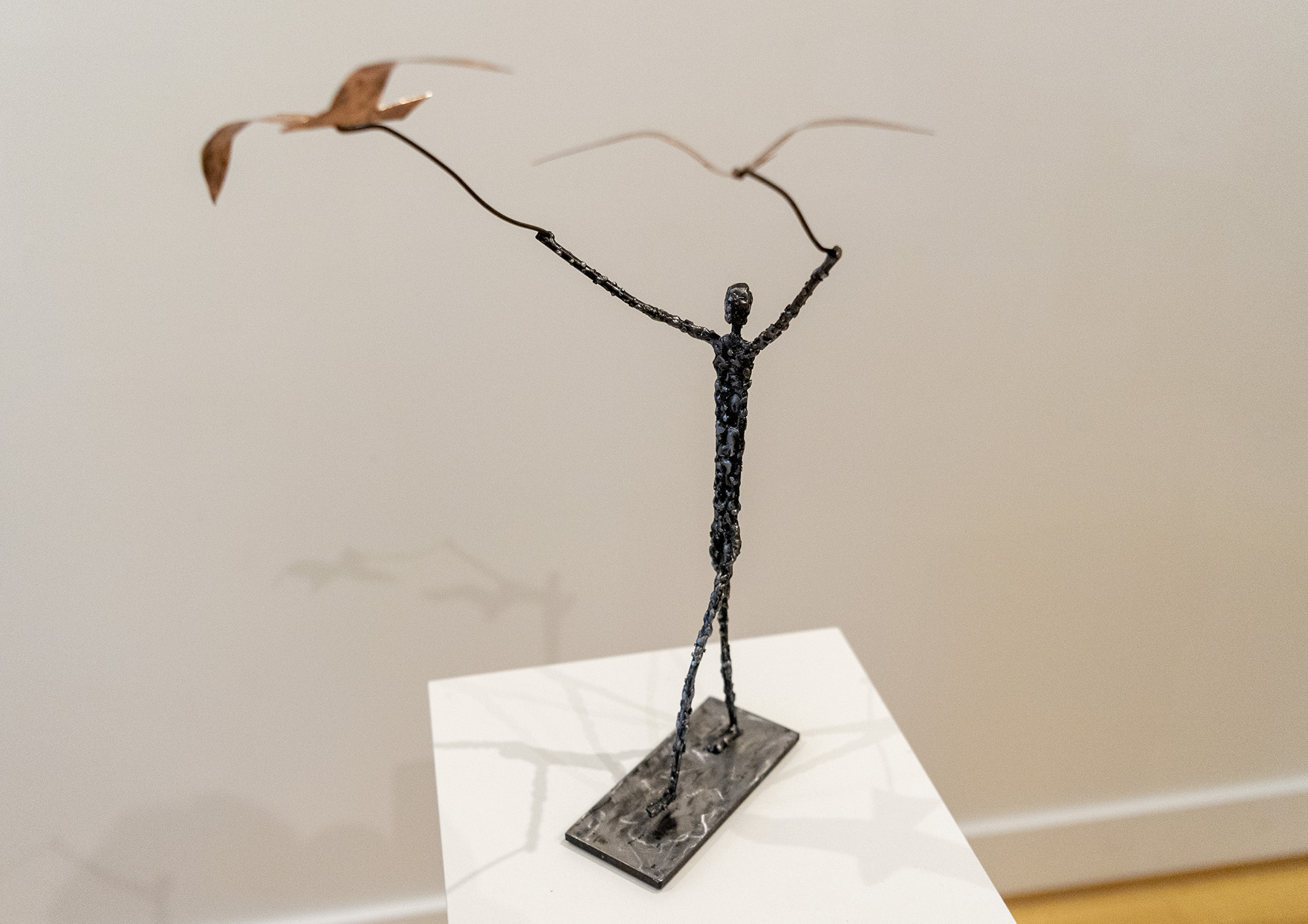 “Walking the Birds,” a sculpture by Bill Leigh made from reclaimed BBQ grate, a copper fire bowl and scrap steel sits on a pedestal Tuesday, Jan. 11, 2022, at Art at the Cave gallery in Vancouver. Leigh’s exhibit, “Trash to Treasure,” runs through Jan. 29.
