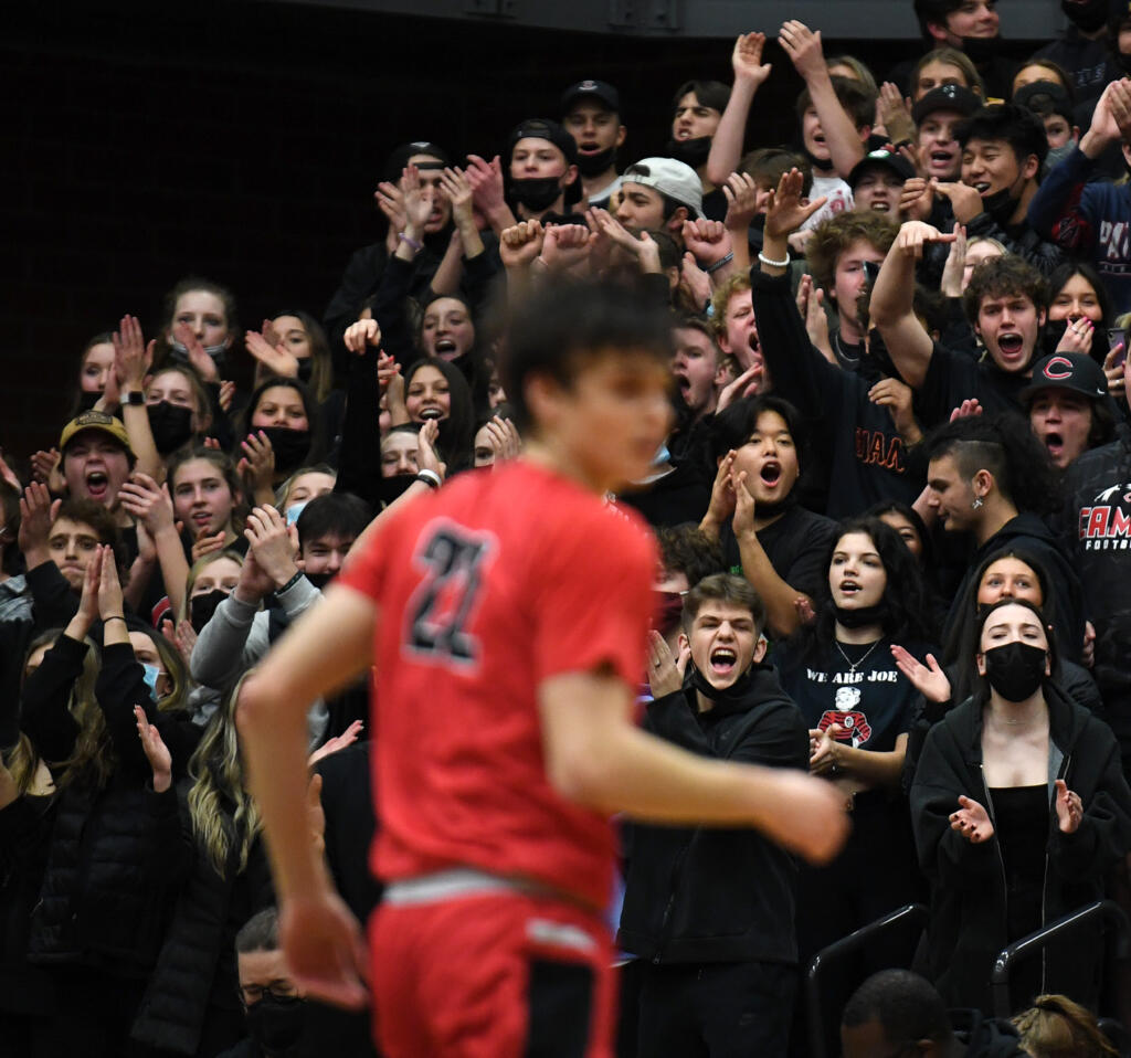 Camas students celebrate a basket Wednesday, Jan. 12, 2022, during the Papermakers’ 72-60 loss to the Titans at Union High School.