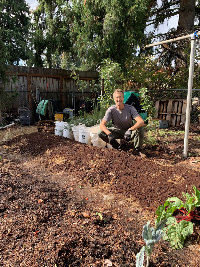 At left, Pete DuBois, coordinator of the Clark County Master Composter Recycler program, at home with his lasagna beds, a form of composting and gardening in raised, thin layers.
