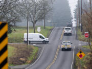 Motorists navigate a four-way stop at the busy intersection of Northeast 179th Street and Northeast 29th Avenue north of Vancouver.  A roundabout is planned for the intersection.