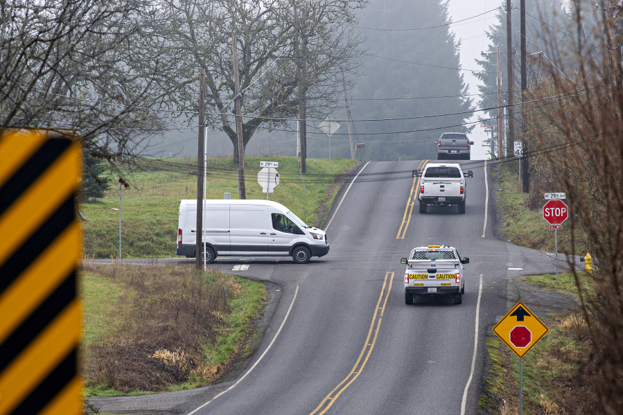 Motorists navigate a four-way stop at the busy intersection of Northeast 179th Street and Northeast 29th Avenue north of Vancouver.  A roundabout is planned for the intersection.