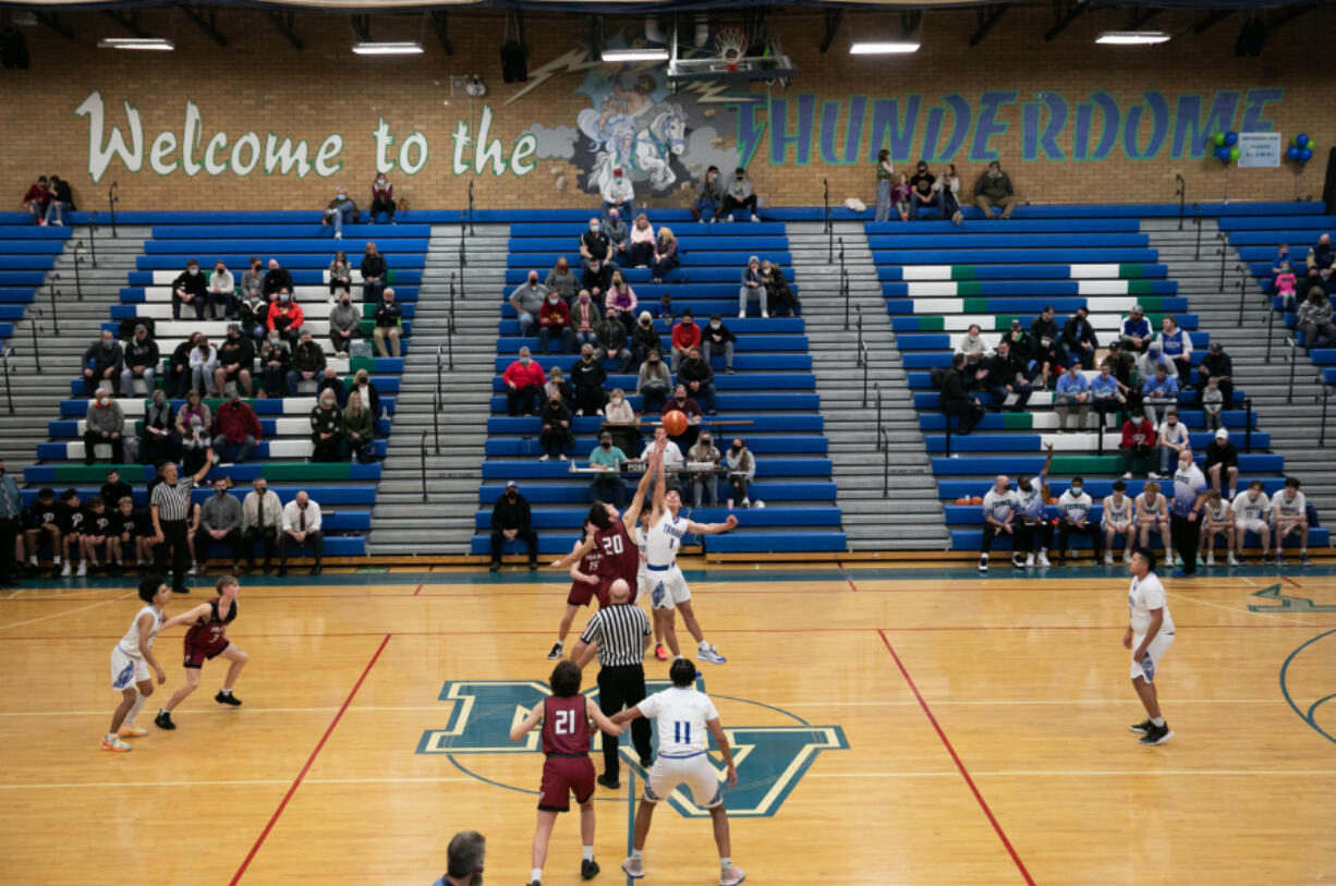 The ball is tipped off as Mountain View takes on Prairie during the first quarter of a basketball game at Mountain View High School on Friday, January 28, 2022. This is the final basketball season that will be played in the schools original gym.