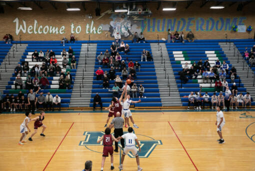 The ball is tipped off as Mountain View takes on Prairie during the first quarter of a basketball game at Mountain View High School on Friday, January 28, 2022. This is the final basketball season that will be played in the schools original gym.