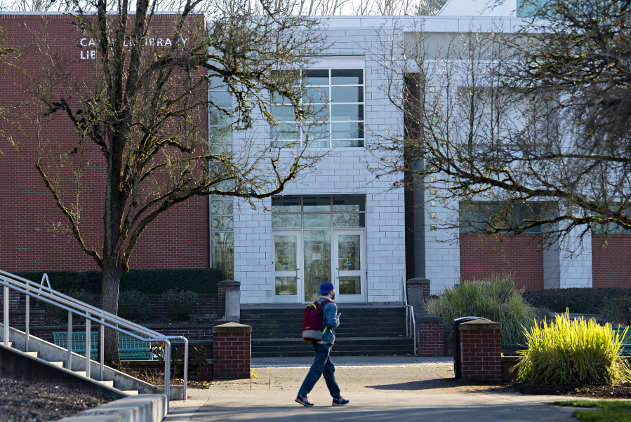 A student strolls through campus at Clark College on a sunny, chilly morning Friday. The majority of classes have been taught remotely since Clark's winter term began on Jan. 3.