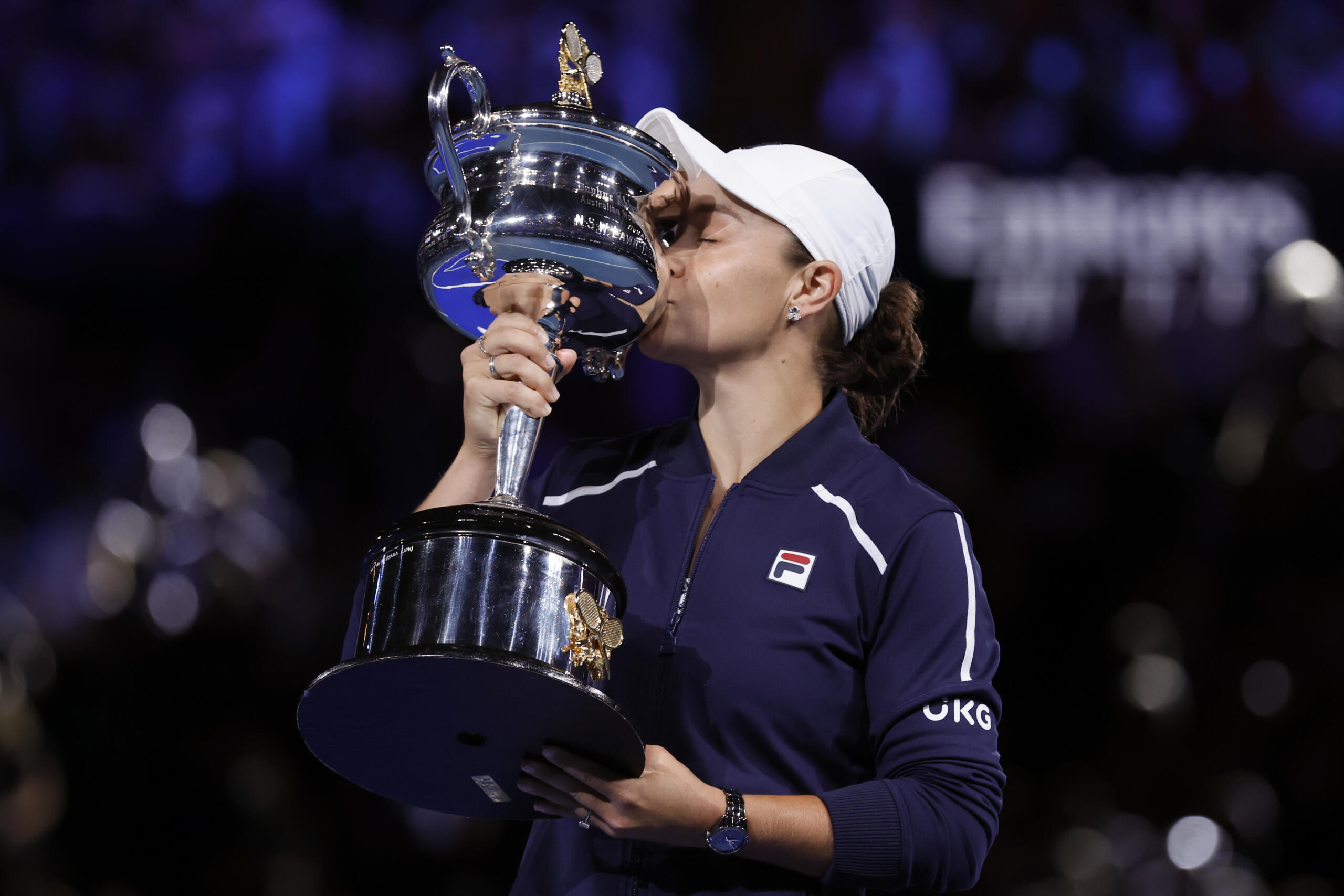 Ash Barty of Australia kisses the Daphne Akhurst Memorial Cup after defeating Danielle Collins of the U.S., in the women's singles final at the Australian Open tennis championships in Saturday, Jan.