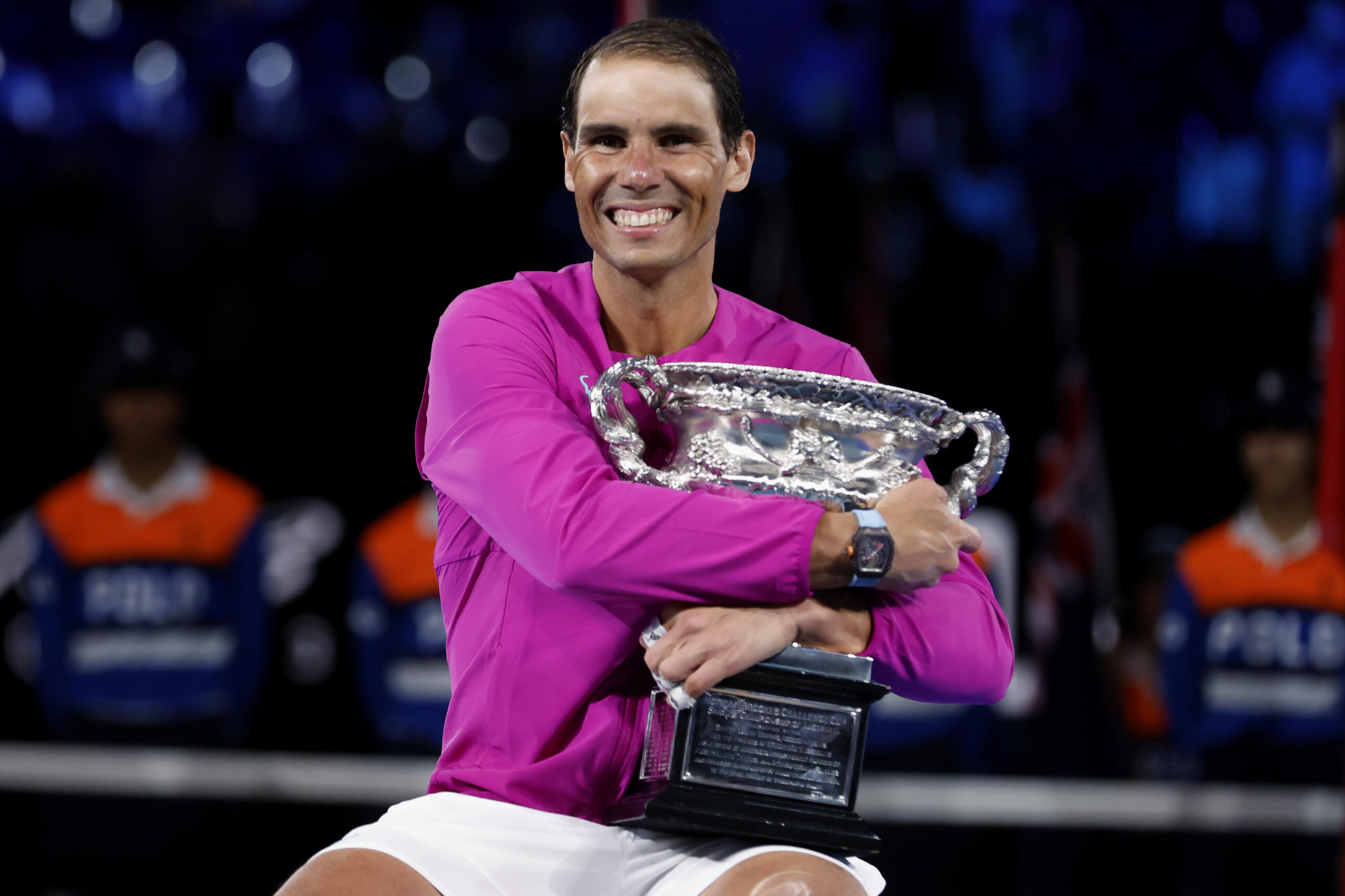 Rafael Nadal of Spain holds the Norman Brookes Challenge Cup after defeating Daniil Medvedev of Russia in the men's singles final at the Australian Open tennis championships in Melbourne, Australia, early Monday, Jan. 31, 2022.