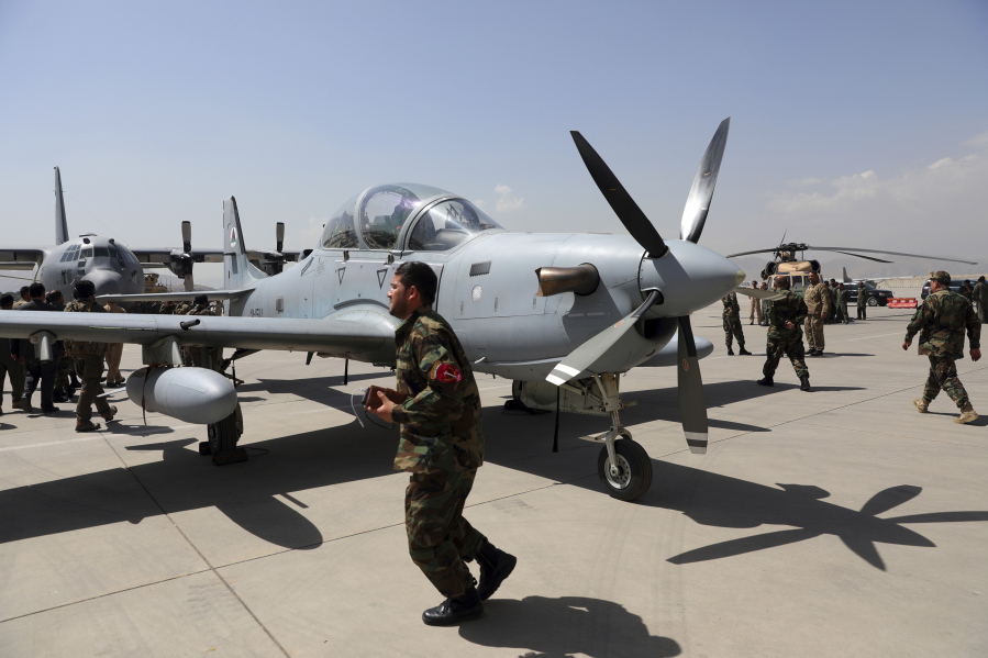 FILE - A-29 Super Tucano planes are on display during a handover from the NATO-led Resolute Support mission to the Afghan army at the military Airport in Kabul, Afghanistan, Sept. 17, 2020. A year-old report by Washington's Afghanistan watchdog warned in early 2021, months before President Joe Biden announced the end to America's longest war, the Afghan air force would collapse without critical U.S. aid, training and American maintenance. The report by the Special Inspector General for Afghanistan Reconstruction John Sopko was classified back when it was written and only declassified on Tuesday, Jan. 18, 2021.